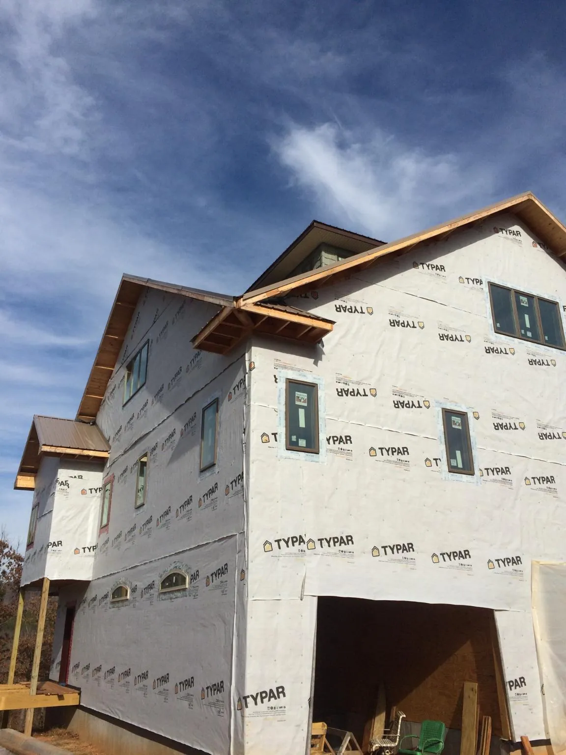 Stick built house wrapped in Typar with new roof framing and dormers in Pine Valley